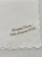 Embroidered handkerchief with 'Happy Tears 10th August 2024' text on a white background