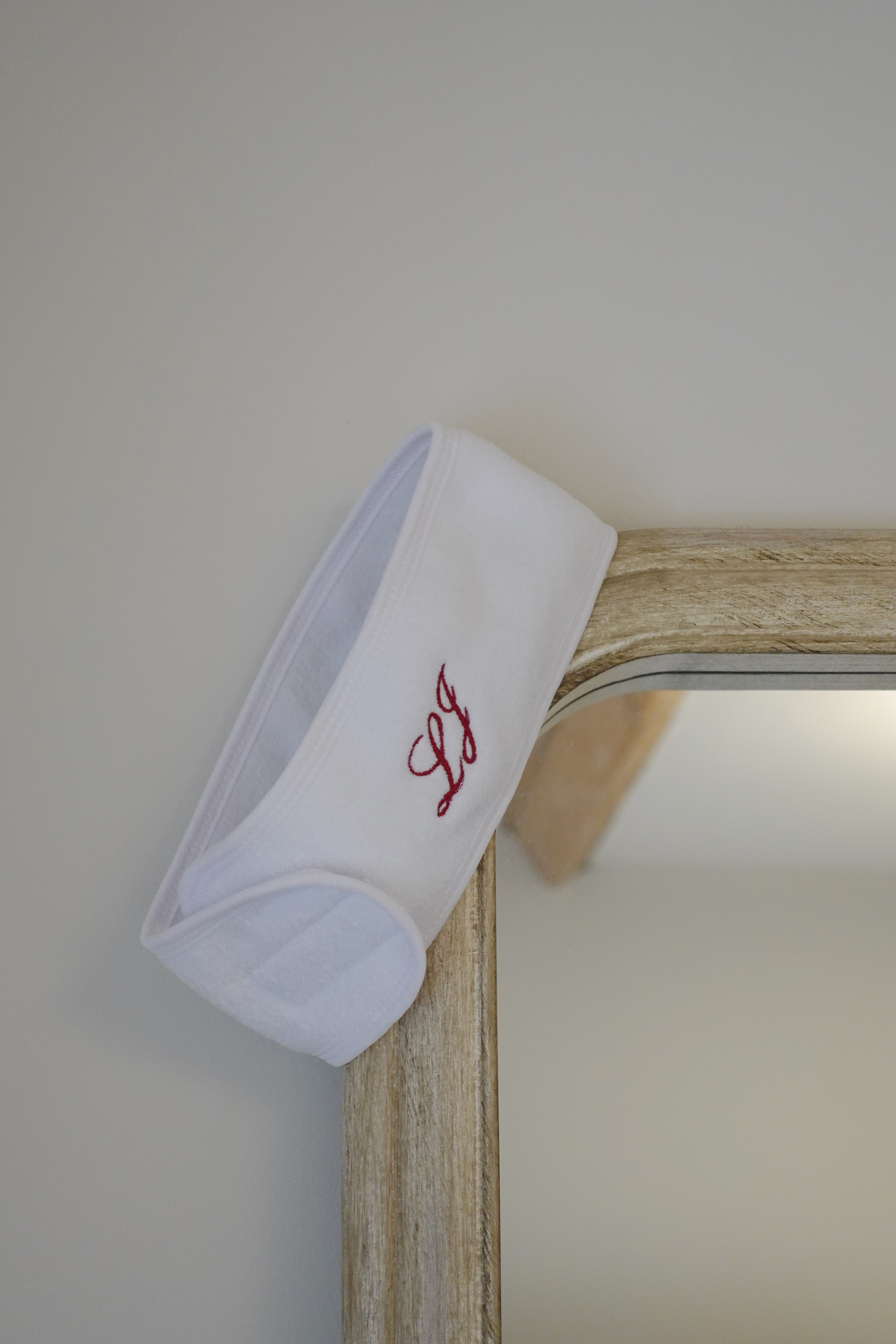 white headband with initial