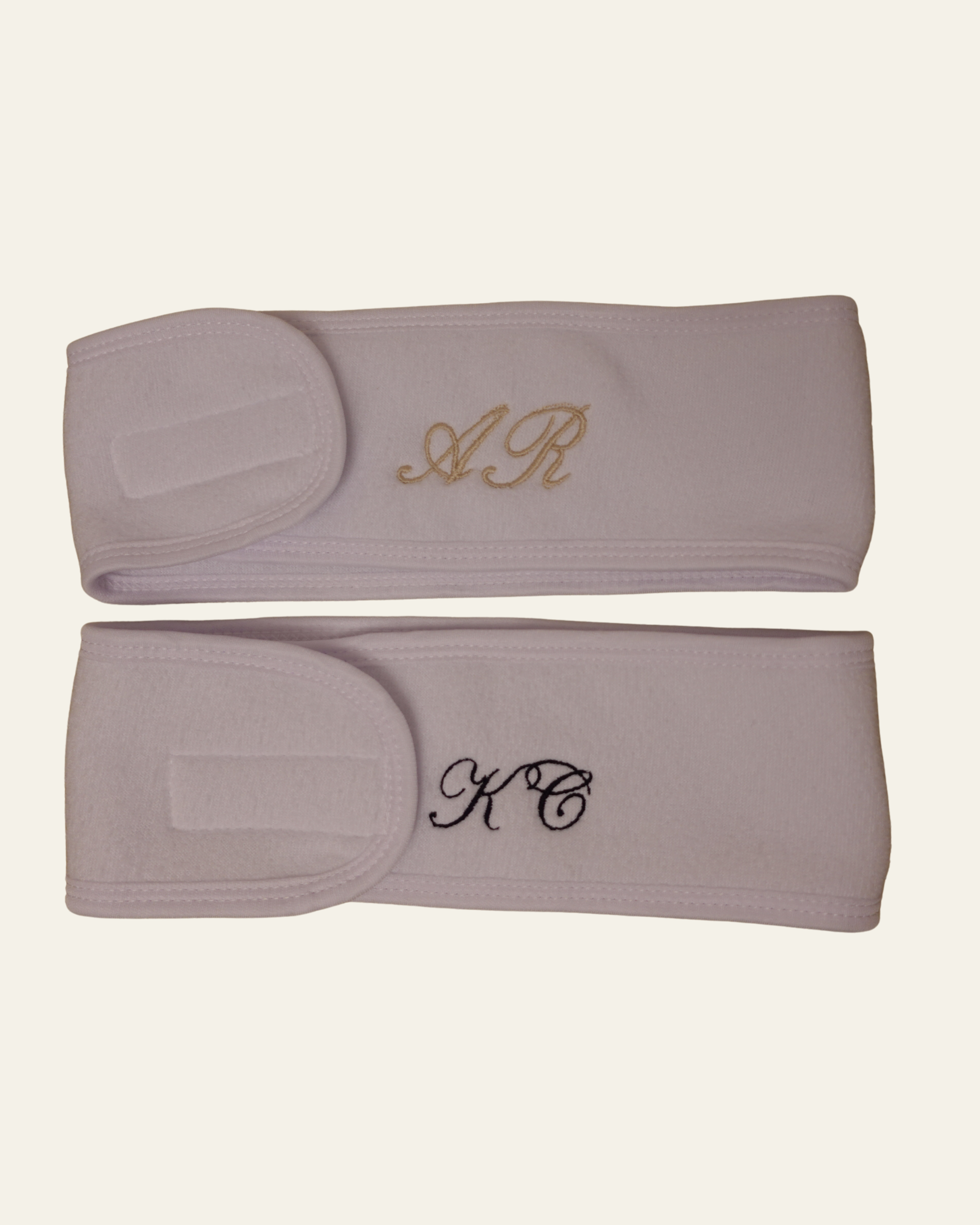 two white spa headbands embroidered