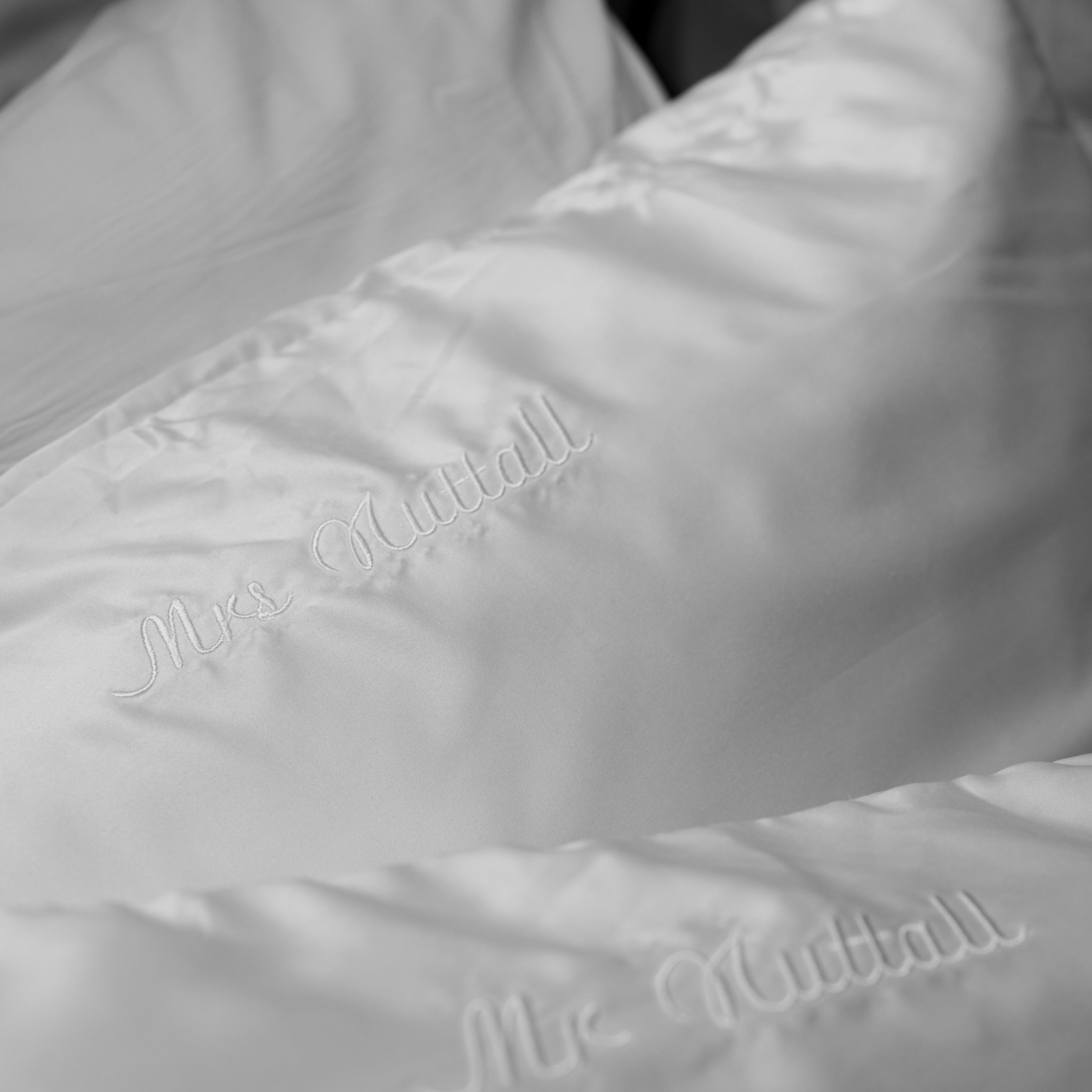 white pillowcases embroidered with names